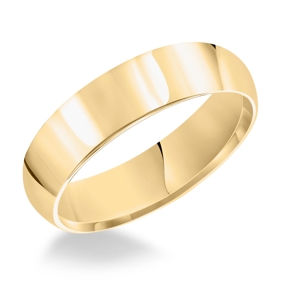 This domed Comfort Fit wedding band features a high polished finish offering a sleek and timeless look