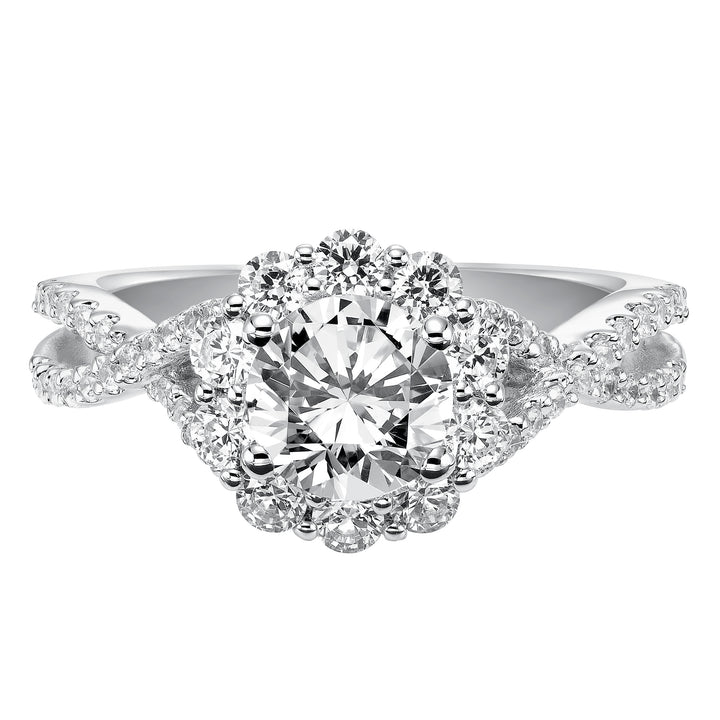 Awe-inspiring sparkle illuminates from this engagement ring featuring a shared prong set diamond halo and elegant twisted diamond band for grand effect.