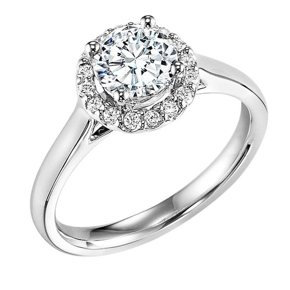 A magnificent diamond prong set halo gracefully accentuates the center diamond whilst paired with a high polished band for a timeless, spectacular design.  Center Stone is not included.