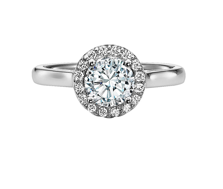 A magnificent diamond prong set halo gracefully accentuates the center diamond whilst paired with a high polished band for a timeless, spectacular design.  Center Stone is not included.