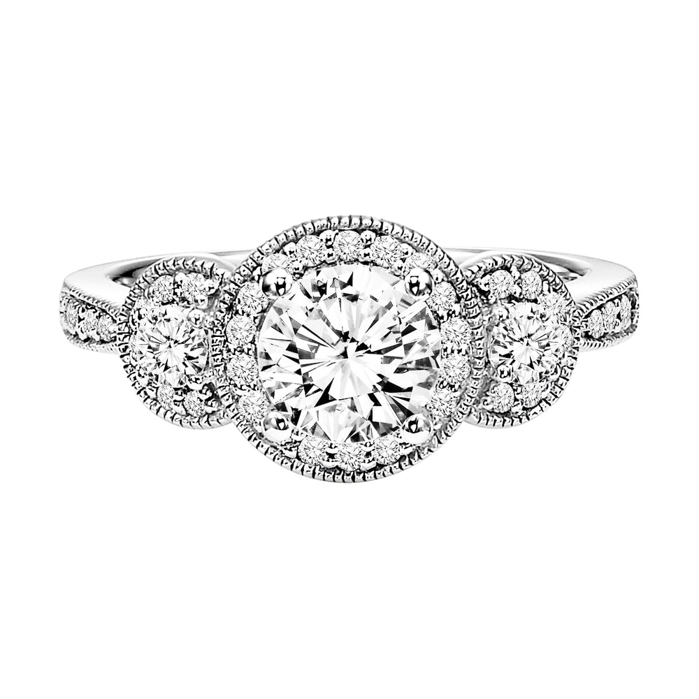 Fusing glamour and vintage flair, this 3-stone round diamond engagement ring features a prong set diamond halo and band with milgrain detailing .  Center Stone is not included.