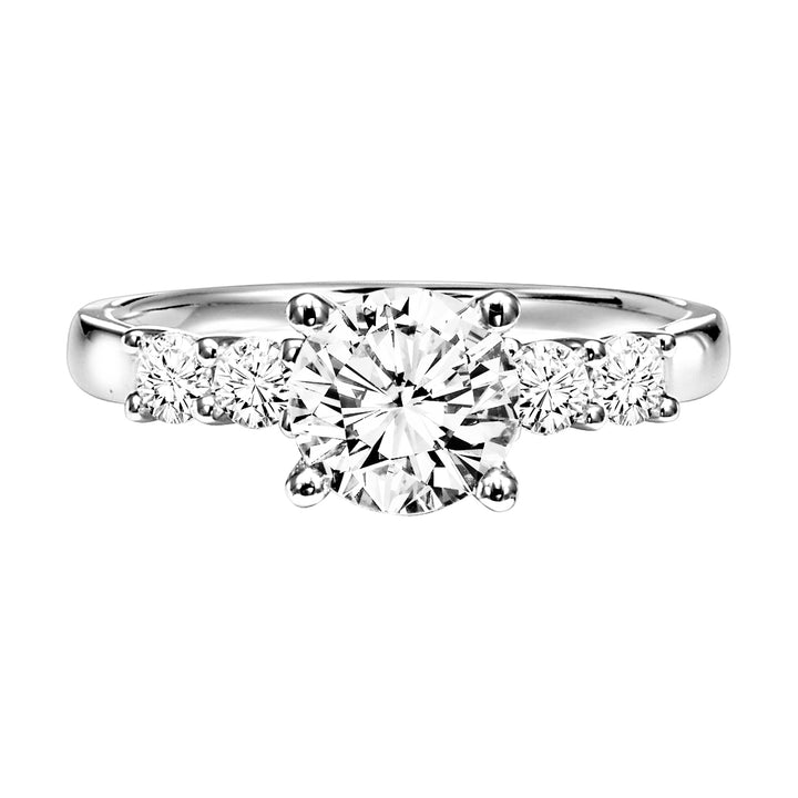 Featuring a brilliant round diamond center stone with a two prong set round diamonds on each side with a high polished band, this engagement ring is simply stunning.  Center Stone is not included.