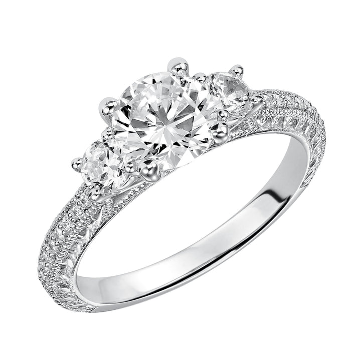 This eye-catching 3-stone engagement sparkles with its diamond prong set band with engraving and milgrain details.  Center Stone is not included.