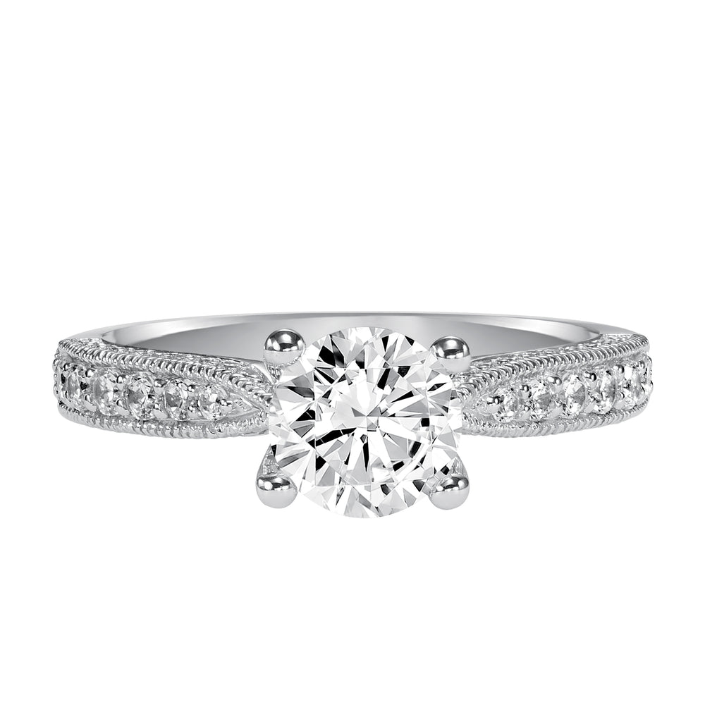 Milgrain detailing accents the diamond prong set band of this magnificent engagement ring