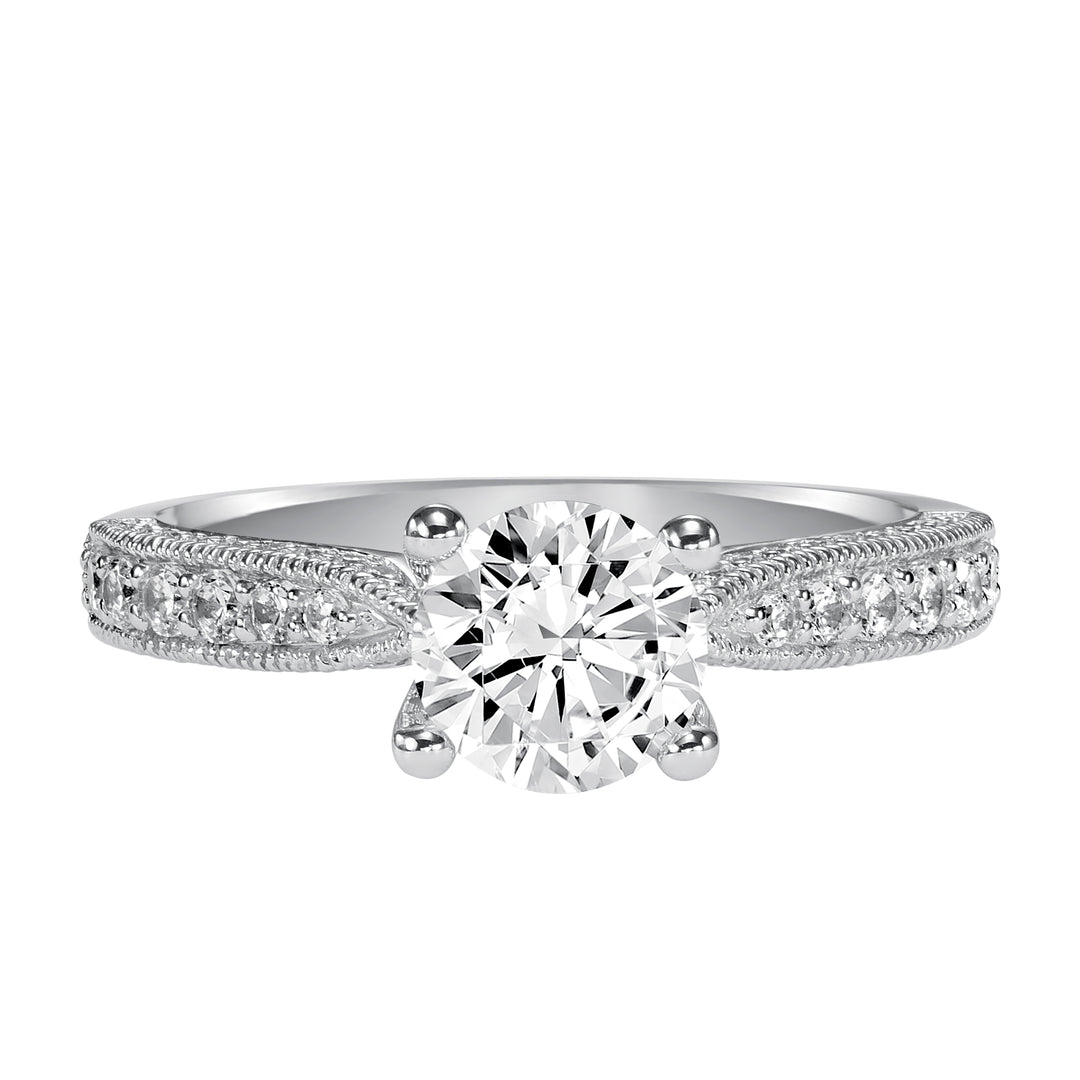 Milgrain detailing accents the diamond prong set band of this magnificent engagement ring