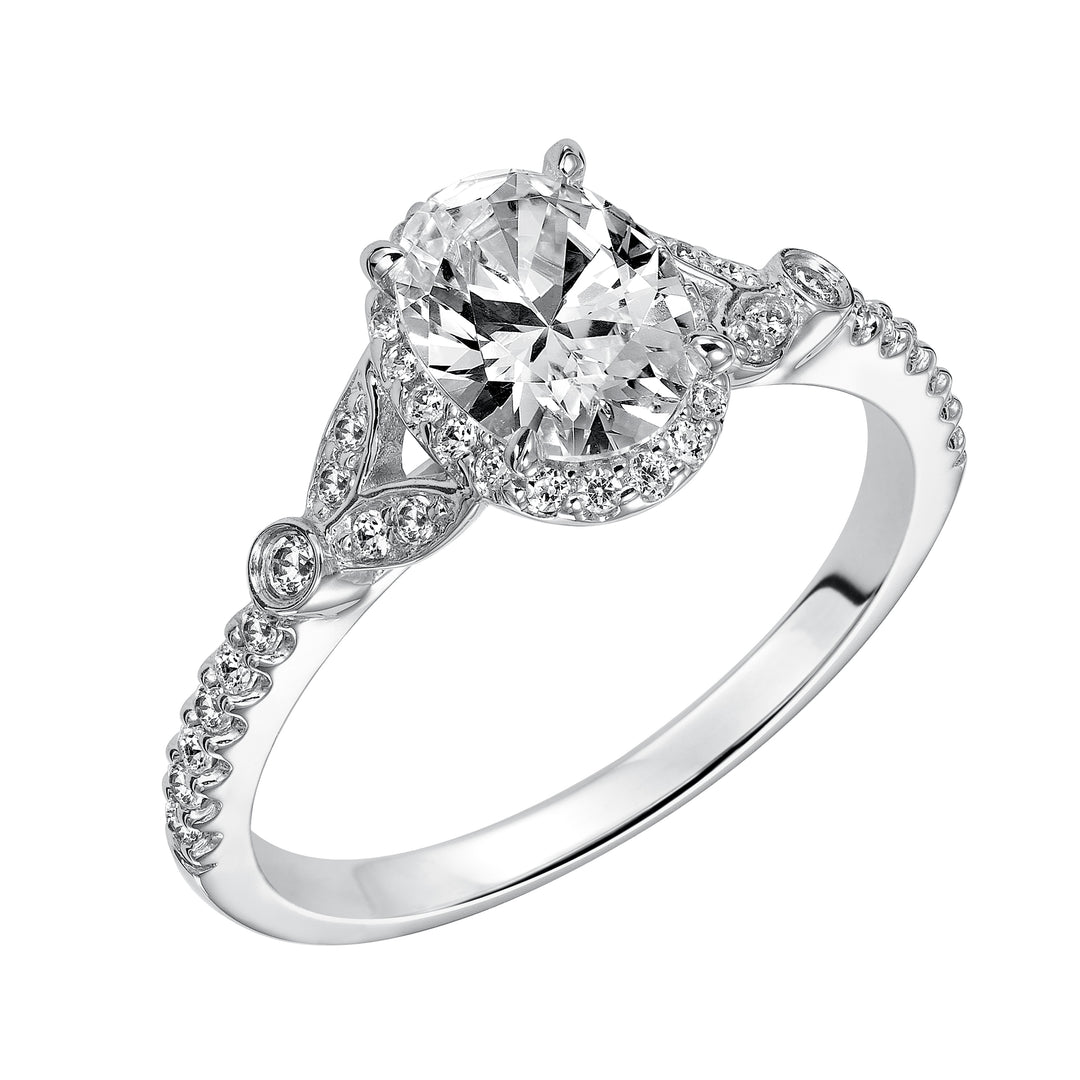 31-838EVW-E.00 - Goldman - This romantic and beautiful engagement ring features an oval cut diamond accentuated by a prong set diamond halo and petal-inspired band design