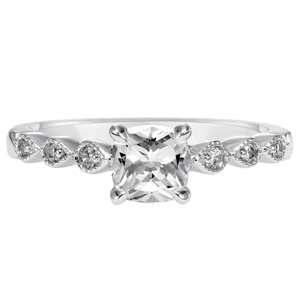 Dazzling with its intricately designed diamond band, this engagement ring is distinct yet enchanting