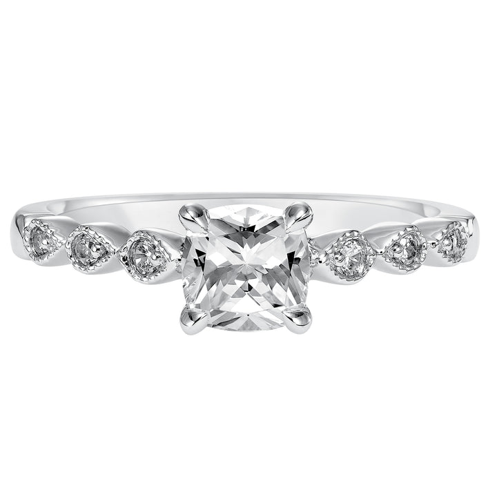 Dazzling with its intricately designed diamond band, this engagement ring is distinct yet enchanting