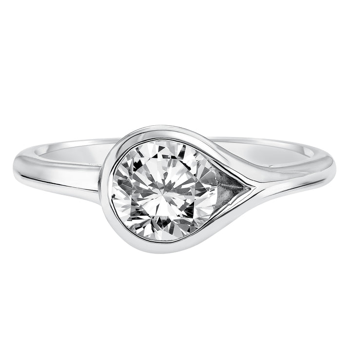Chic and modern, this engagement ring is set beautifully in a high polished bezel set and bypass designed band