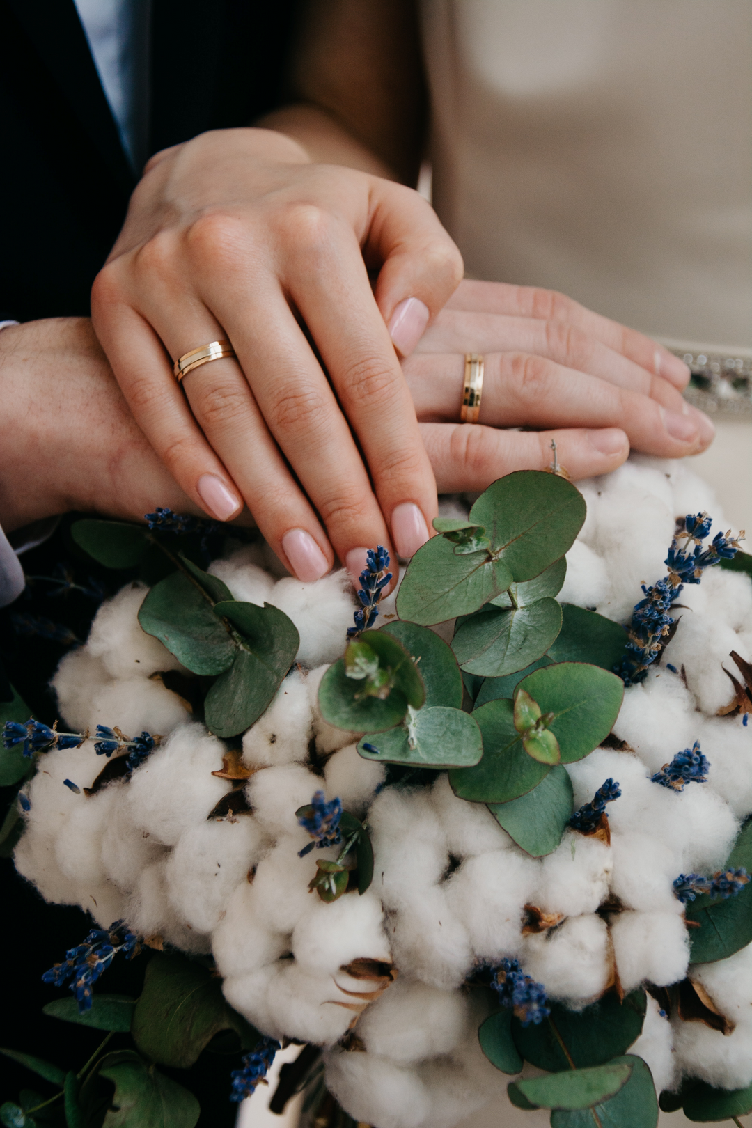bride and groom with their wedding rings