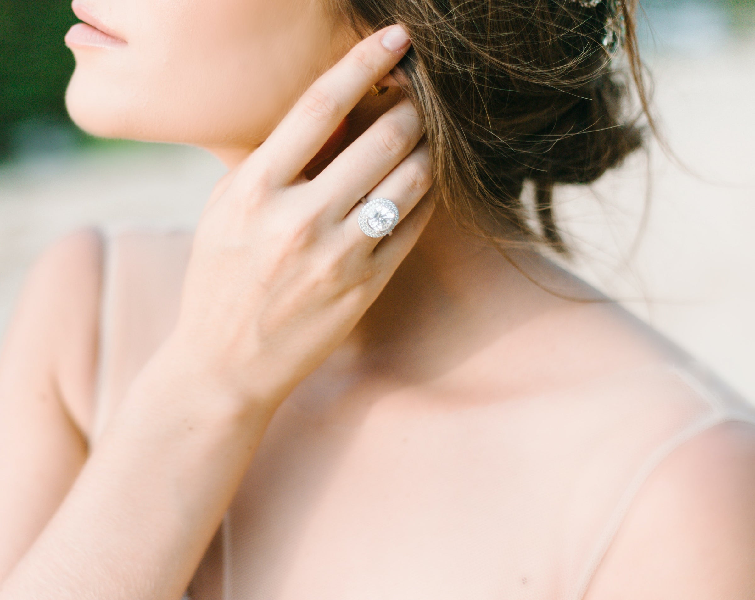 a bride showing off her wedding ring